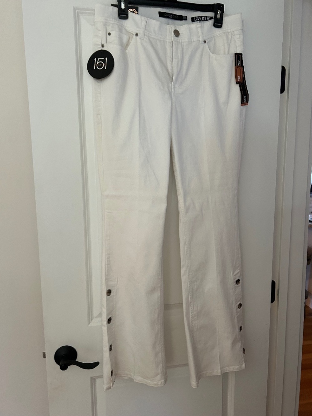 New with tags white boot cut pants.
